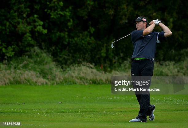 Darren Bragg of North London Golf Academy Ltd plays his approach shot to the 11th green during the Golfbreaks.com PGA Fourball Championship -...