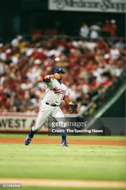 José Macías of the Montreal Expos fields against the St. Louis Cardinals at Busch Stadium on August 8, 2002 in St. Louis, Missouri. The Cardinals won...