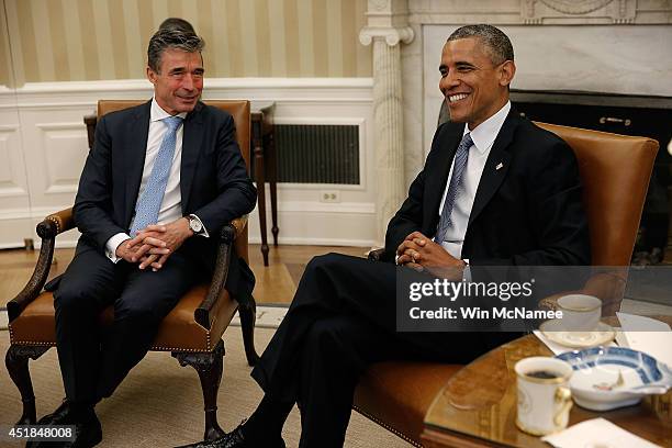 President Barack Obama meets with NATO Secretary General Anders Fogh Rasmussen in the Oval Office at the White House July 8, 2014 in Washington, DC....