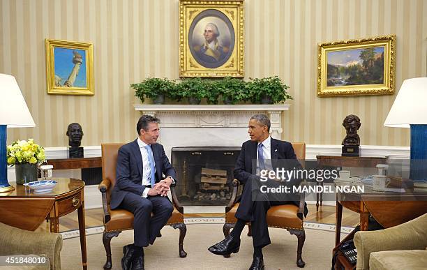 President Barack Obama meets with NATO Secretary General Anders Fogh Rasmussen on July 8, 2014 in the Oval Office of the White House in Washington,...