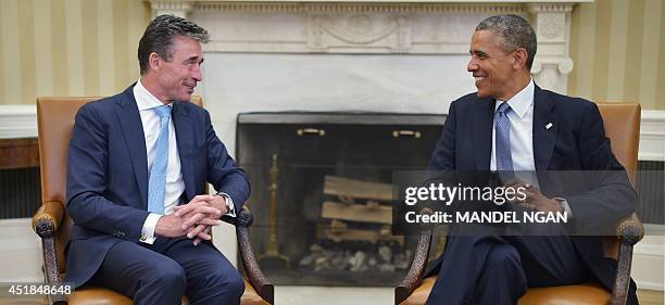 President Barack Obama meets with NATO Secretary General Anders Fogh Rasmussen on July 8, 2014 in the Oval Office of the White House in Washington,...