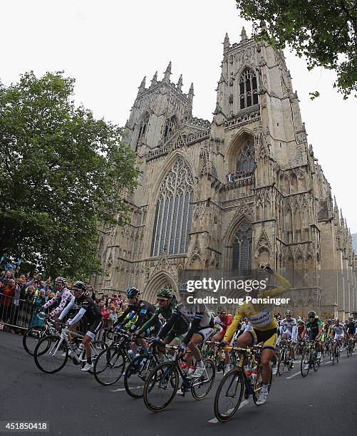 The peloton lead by Marcel Kittel of Germany and Team Giant-Shimano in the yellow jersey leaves the start of stage two of the 2014 Le Tour de France...