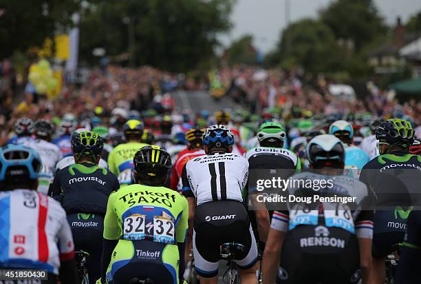 The peloton rides into a sea of fans as they start stage two of the 2014 Le Tour de France from York to Sheffield on July 6, 2014 in York, United...