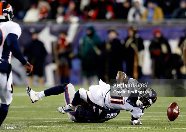 Wide receiver Trindon Holliday of the Denver Broncos cannot handle the ball as wide receiver Matthew Slater of the New England Patriots makes the...