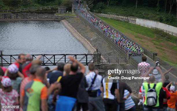 The peloton passes through the countryside as spectators watch during stage two of the 2014 Le Tour de France from York to Sheffield on July 6, 2014...