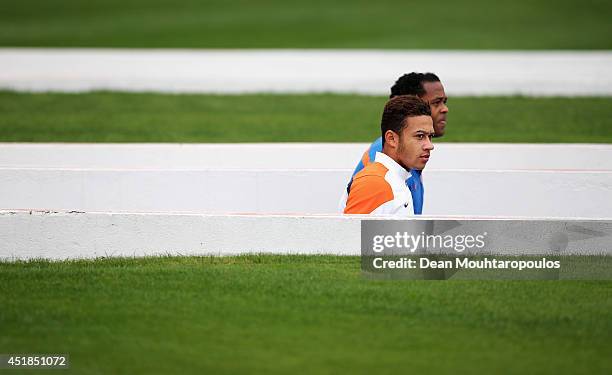 Memphis Depay and Patrick Kluivert, Netherlands assistant coach walk out of the tunnel during the Netherlands training session at the 2014 FIFA World...