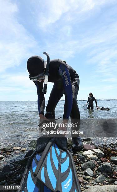 Three Seas student Luke Belding, foreground, and lab tech Forest Schenck head out for their second dive of the afternoon to collect biomass core...