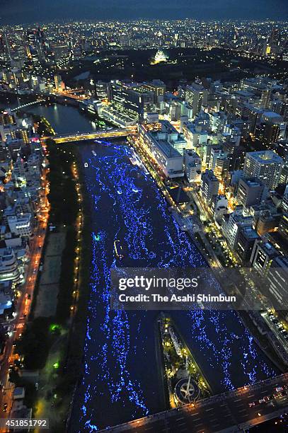 In this aerial image, the LED lights are afloat to draw the milky way at Okawa River to celebrate the Tanabata festival on July 7, 2014 in Osaka,...