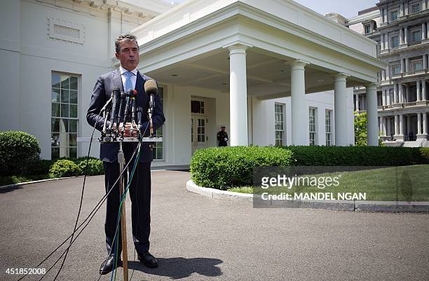 Secretary General Anders Fogh Rasmussen speaks to reporters outside of the West Wing of the White House following a meeting with US President Barack...