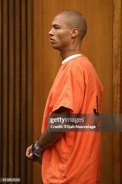 Jeremy Meeks is led into the courtroom prior to a brief appearance July 8, 2014 in Stockton, California. During the appearance the state agreed to...