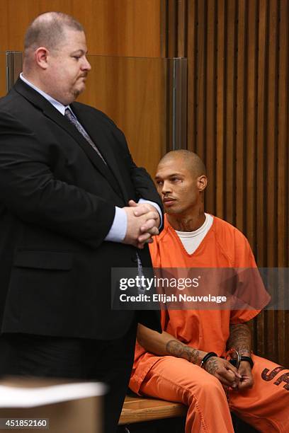 Jeremy Meeks, right, looks at family members during a court appearance July 8, 2014 in Stockton, California. During his brief appearance the state...