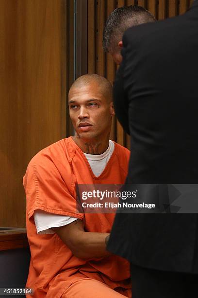 Jeremy Meeks looks at family members during a court appearance July 8, 2014 in Stockton, California. During his brief appearance the state agreed to...