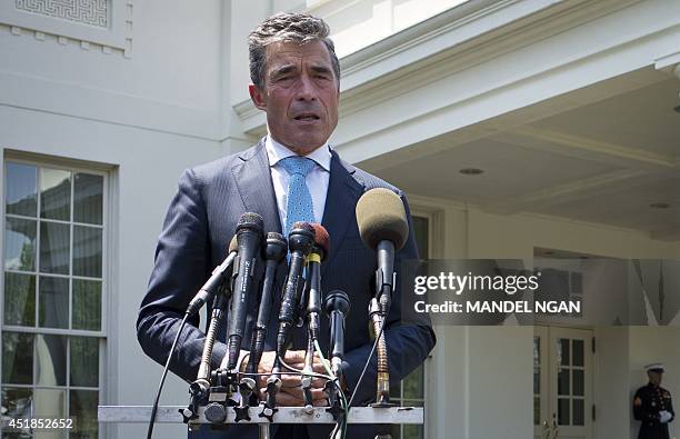 Secretary General Anders Fogh Rasmussen speaks to reporters outside of the West Wing of the White House following a meeting with US President Barack...