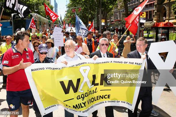 Paul Roos the coach of the Demons, Phil Cleary and Denis Napthine the Victorian Premier lead the group as they take part in the 'Walk Against Family...