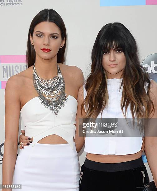 Models Kendall Jenner and Kylie Jenner attend the 2013 American Music Awards at Nokia Theatre L.A. Live on November 24, 2013 in Los Angeles,...