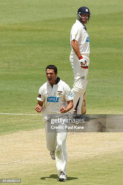 Nathan Coulter-Nile of the Warriors celebrates the wicket of Clint McKay of the Bushrangers during day four of the Sheffield Shield match between the...