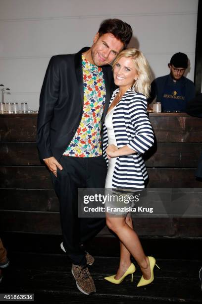 Andre Borchers and Jennifer Knaeble attend the Arqueonautas Presents Kevin Costner - Music Meets Fashion at Spindler & Klatt on July 08, 2014 in...