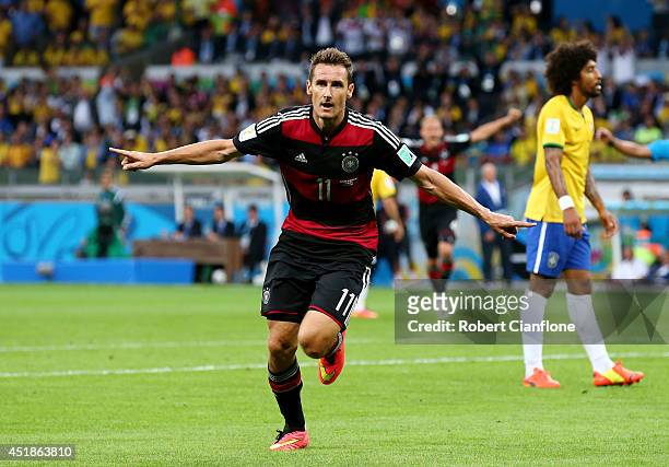 Miroslav Klose of Germany celebrates scoring his team's second goal during the 2014 FIFA World Cup Brazil Semi Final match between Brazil and Germany...