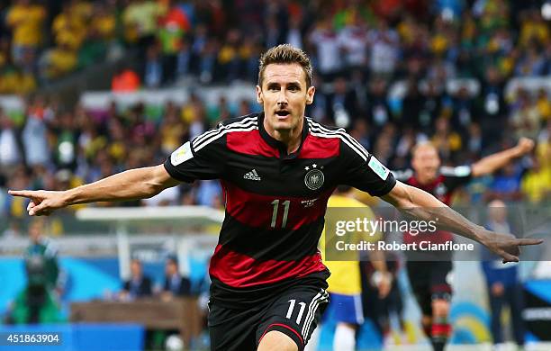 Miroslav Klose of Germany celebrates scoring his team's second goal during the 2014 FIFA World Cup Brazil Semi Final match between Brazil and Germany...