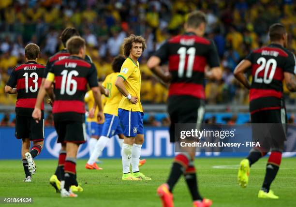 David Luiz of Brazil shows his dejection after conceding fourth goal to Germany during the 2014 FIFA World Cup Brazil Semi Final match between Brazil...