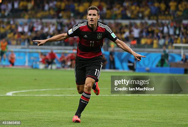 Miroslav Klose of Germany celebrates after he scores during the 2014 FIFA World Cup Brazil Semi Final match between Brazil and Germany at The Estadio...