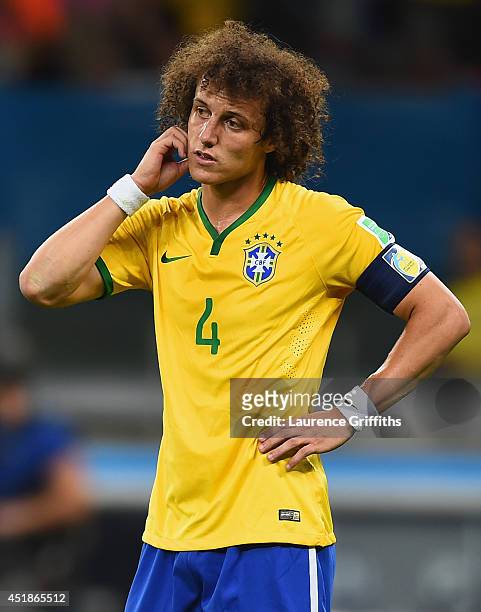 David Luiz of Brazil looks dejected during the 2014 FIFA World Cup Brazil Semi Final match between Brazil and Germany at Estadio Mineirao on July 8,...
