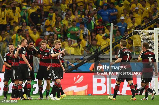 Germany's players including Germany's midfielder Sami Khedira, Germany's forward Thomas Mueller, Germany's midfielder Toni Kroos, Germany's...