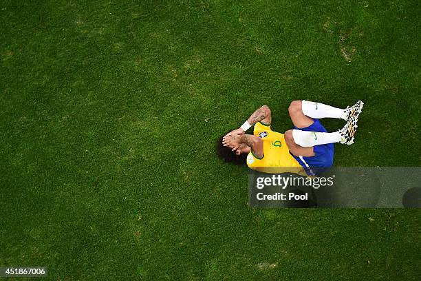 Marcelo of Brazil reacts during the 2014 FIFA World Cup Brazil Semi Final match between Brazil and Germany at Estadio Mineirao on July 8, 2014 in...