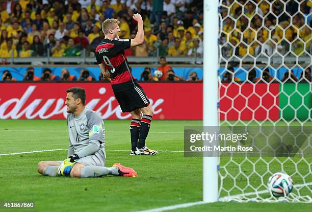 Andre Schuerrle of Germany celebrates scoring his team's sixth goal past goalkeeper Julio Cesar of Brazil during the 2014 FIFA World Cup Brazil Semi...