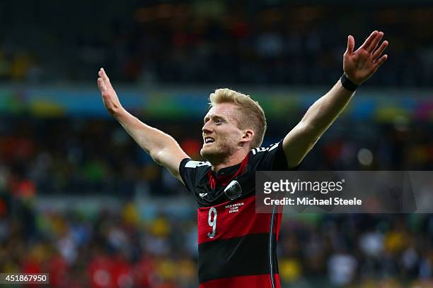 Andre Schuerrle of Germany celebrates scoring his team's seventh goal and his second of the game during the 2014 FIFA World Cup Brazil Semi Final...