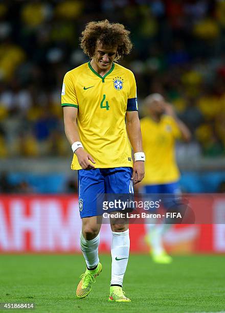David Luiz of Brazil reacts after conceding the seventh goal to Germany during the 2014 FIFA World Cup Brazil Semi Final match between Brazil and...