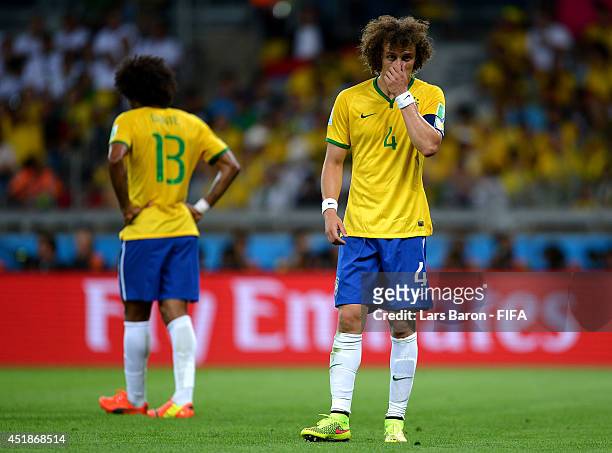 David Luiz of Brazil reacts during the 2014 FIFA World Cup Brazil Semi Final match between Brazil and Germany at Estadio Mineirao on July 8, 2014 in...
