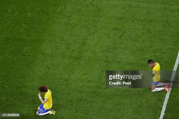 David Luiz and Luiz Gustavo of Brazil react after being defeated by Germany 7-1 during the 2014 FIFA World Cup Brazil Semi Final match between Brazil...