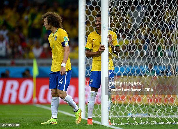 David Luiz of Brazil reacts during the 2014 FIFA World Cup Brazil Semi Final match between Brazil and Germany at Estadio Mineirao on July 8, 2014 in...