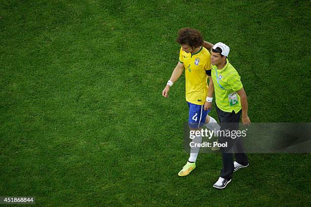 Thiago Silva of Brazil consoles David Luiz after being defeated by Germany 7-1 during the 2014 FIFA World Cup Brazil Semi Final match between Brazil...