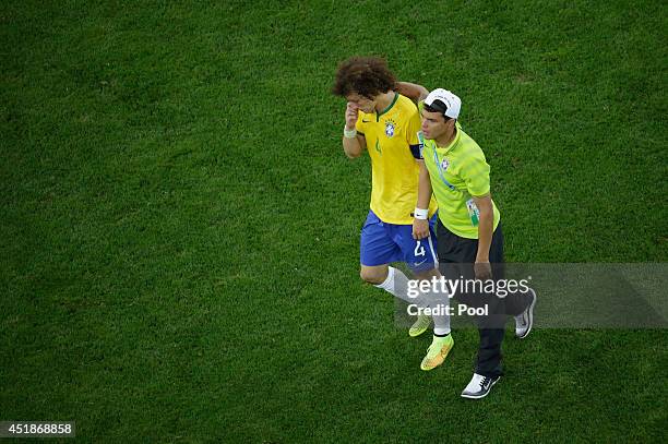 Thiago Silva of Brazil consoles David Luiz after being defeated by Germany 7-1 during the 2014 FIFA World Cup Brazil Semi Final match between Brazil...