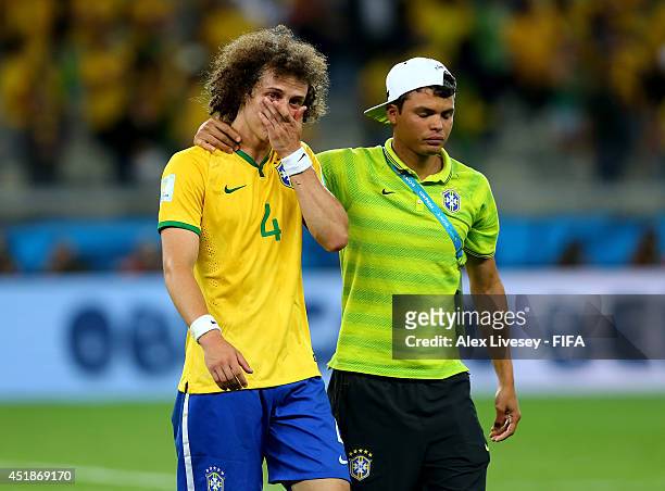 David Luiz of Brazil is consoled by Thiago Silva after the 2014 FIFA World Cup Brazil Semi Final match between Brazil and Germany at Estadio Mineirao...
