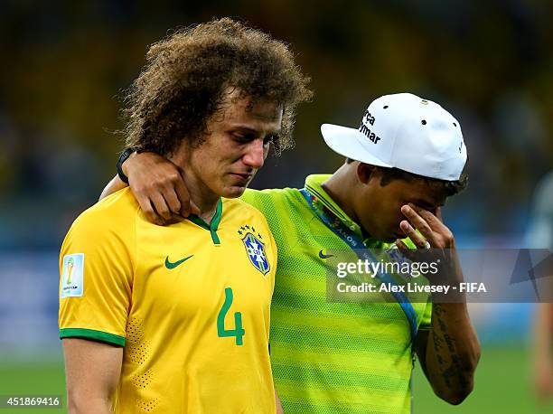 David Luiz and Thiago Silva of Brazil show their dejection after the 1-7 defeat in the 2014 FIFA World Cup Brazil Semi Final match between Brazil and...