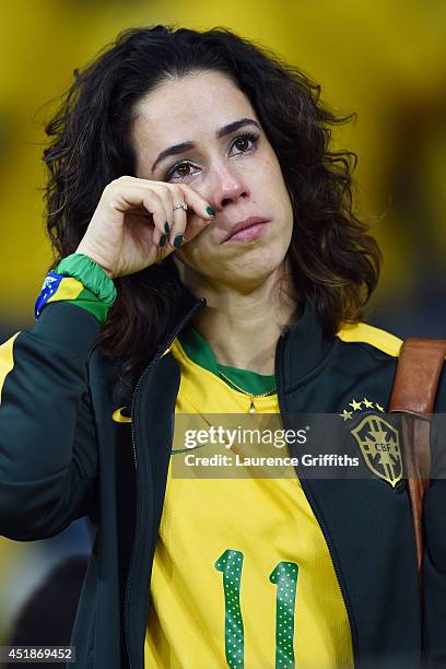 An emotional Brazil fan reacts after being defeated by Germany 7-1 during the 2014 FIFA World Cup Brazil Semi Final match between Brazil and Germany...