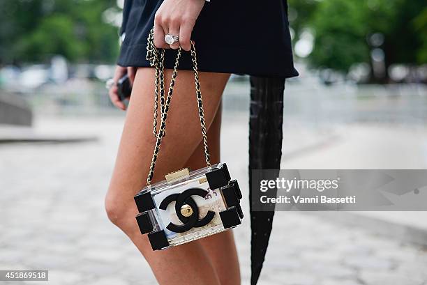 Inga Kozel poses wearing an Azzedine Alaia Couture dress and a Chanel clutch after Chanel show on July 8, 2014 in Paris, France.