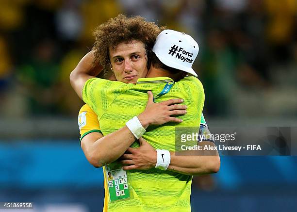 David Luiz and Thiago Silva of Brazil show their dejection after the 1-7 defeat in the 2014 FIFA World Cup Brazil Semi Final match between Brazil and...