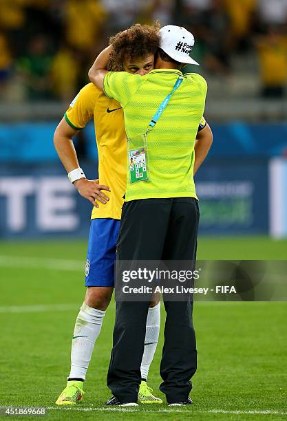 David Luiz and Thiago Silva of Brazil show their dejection after the 1-7 defeat in the 2014 FIFA World Cup Brazil Semi Final match between Brazil and...