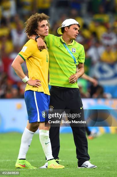 Thiago Silva of Brazil consoles David Luiz after Germany's 7-1 victory during the 2014 FIFA World Cup Brazil Semi Final match between Brazil and...