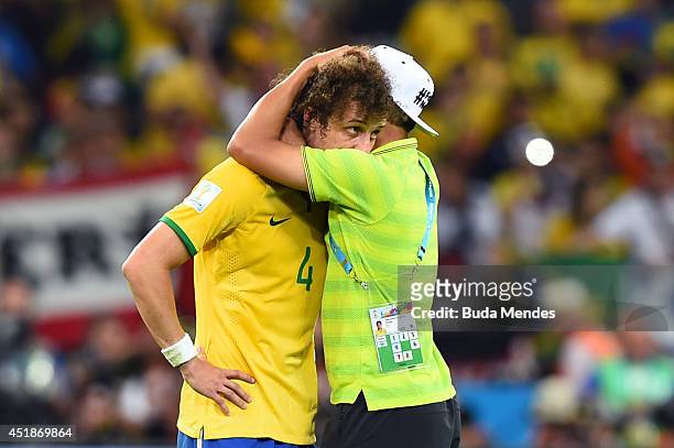 Thiago Silva of Brazil consoles David Luiz after Germany's 7-1 victory during the 2014 FIFA World Cup Brazil Semi Final match between Brazil and...