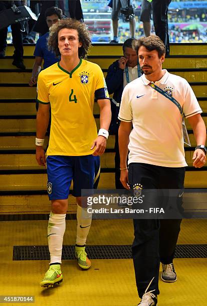 David Luiz of Brazil shows his dejection while walking in the tunnel after the 1-7 defeat in the 2014 FIFA World Cup Brazil Semi Final match between...