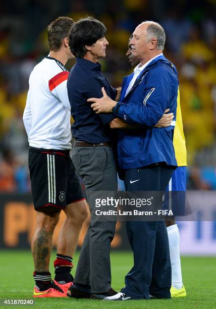 Head coach Joachim Loew of Germany is congratulated the win by Luiz Felipe Scolari of Brazil during the 2014 FIFA World Cup Brazil Semi Final match...
