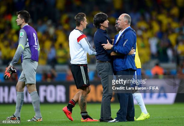 Head coach Joachim Loew of Germany is congratulated the win by Luiz Felipe Scolari of Brazil after the 2014 FIFA World Cup Brazil Semi Final match...