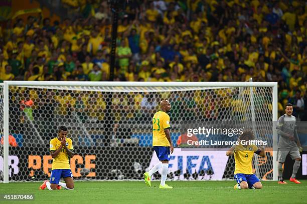 Luiz Gustavo, Maicon, David Luiz and Julio Cesar of Brazil react after a 7-1 defeat to Germany during the 2014 FIFA World Cup Brazil Semi Final match...