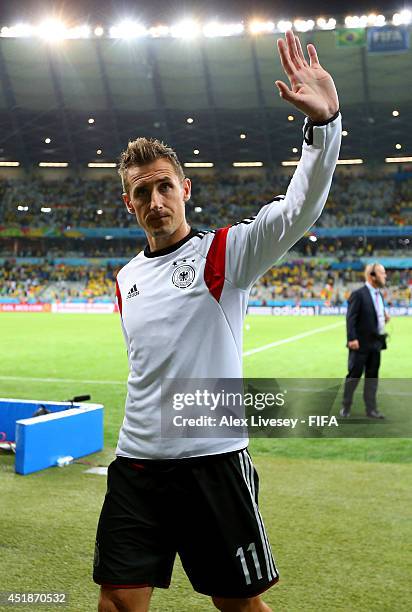 Miroslav Klose of Germany celebrates the 7-1 win while walking off the pitch after the 2014 FIFA World Cup Brazil Semi Final match between Brazil and...