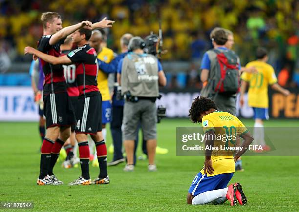 Willian of Brazil reacts after the 1-7 defeat in the 2014 FIFA World Cup Brazil Semi Final match between Brazil and Germany at Estadio Mineirao on...